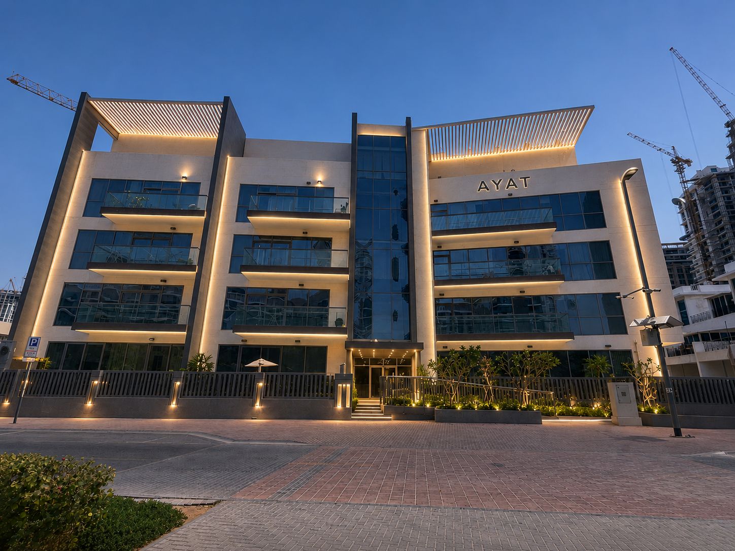 Residential building façade with linear architectural lighting at dusk